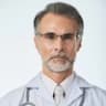Senior male doctor with glasses and stethoscope providing expert medical consultation