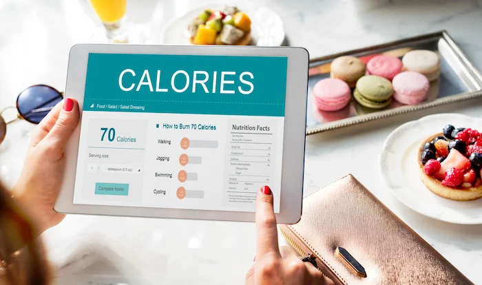 Tablet showing calorie tracker and nutrition facts for healthy eating decisions
